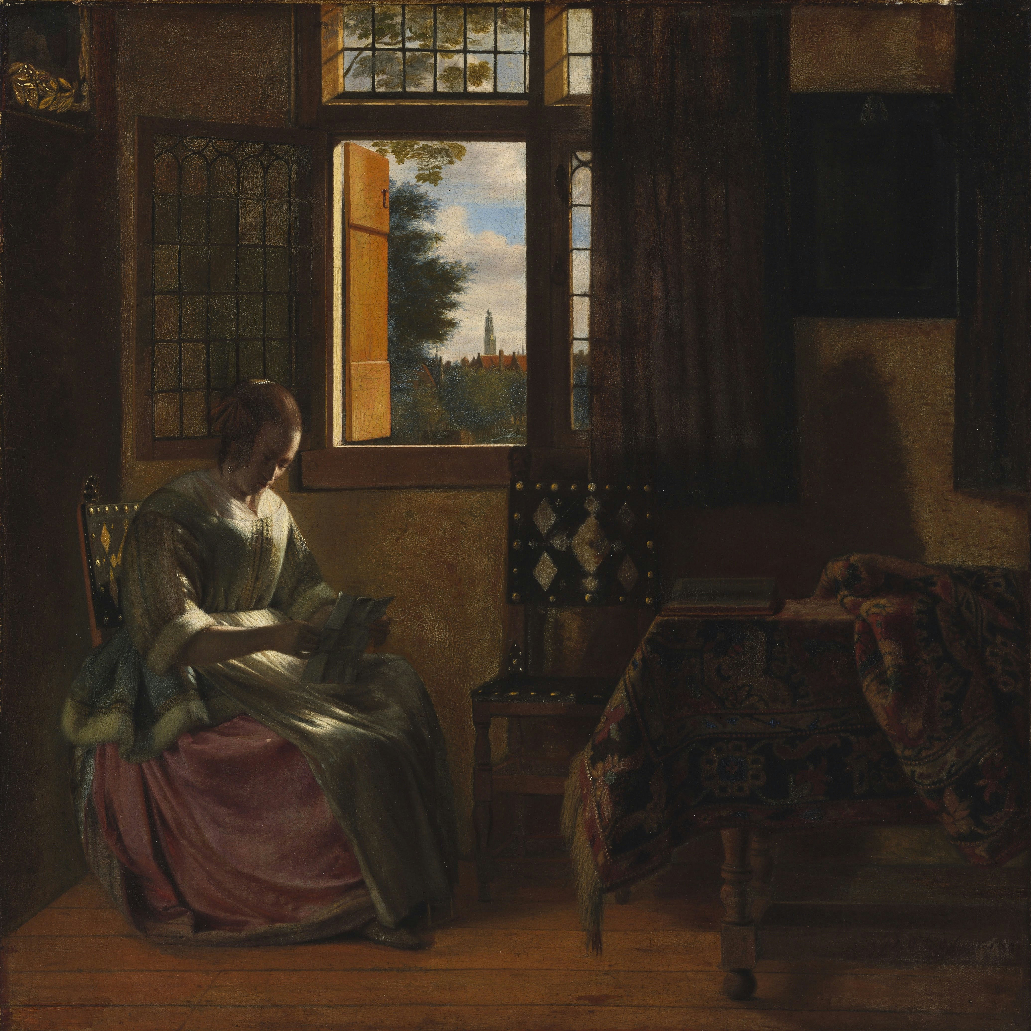 《在窗边读信的女人》